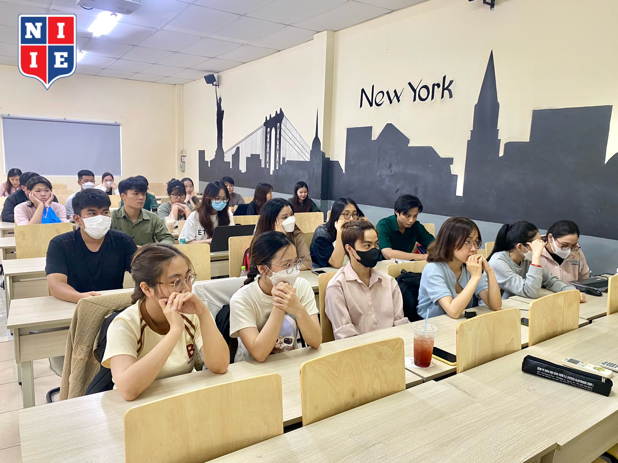 Students listen attentively to practical sharing from speakers.